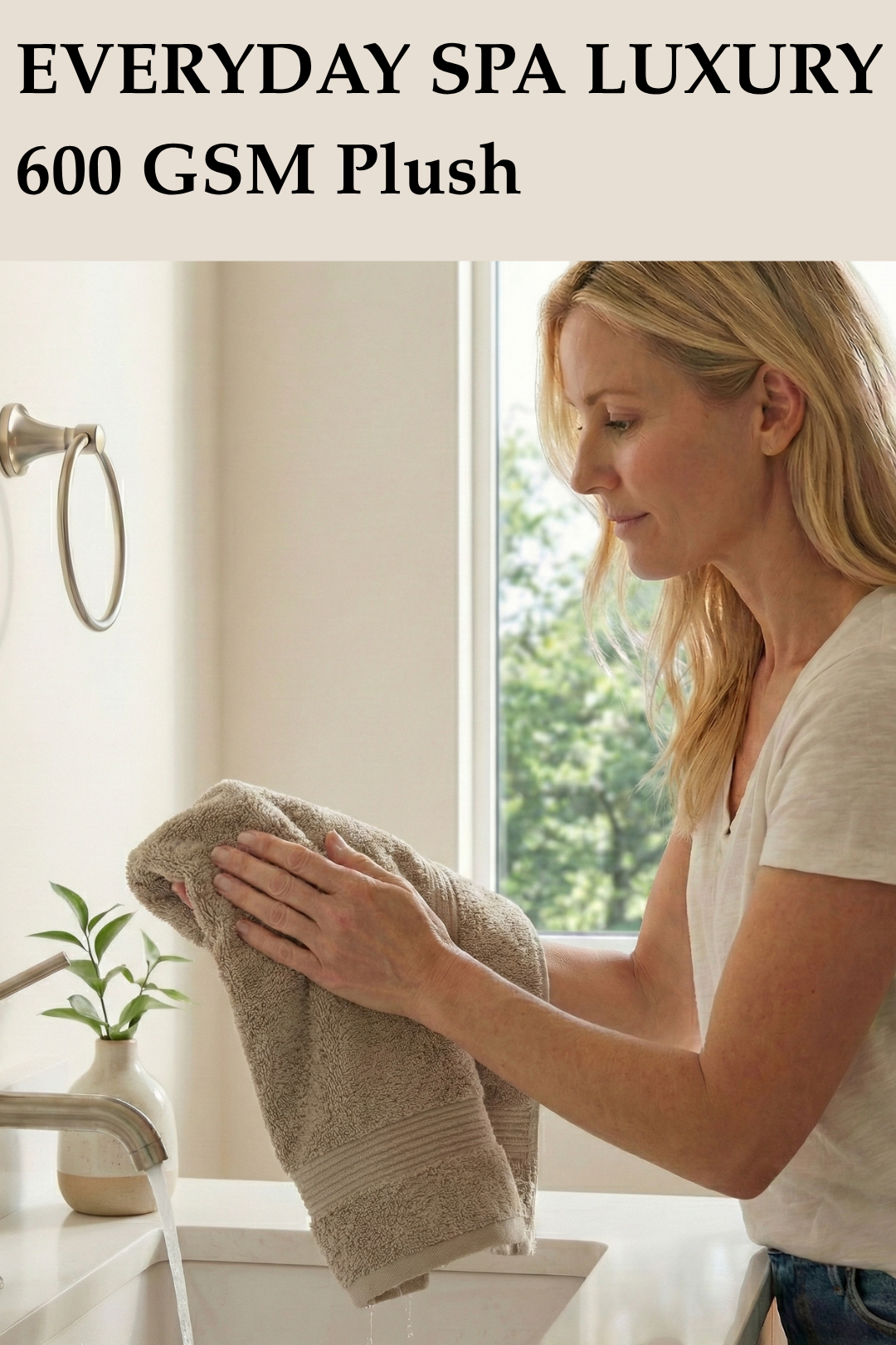 Woman drying her hands at a bathroom sink using a brown 600 GSM plush hand towel.