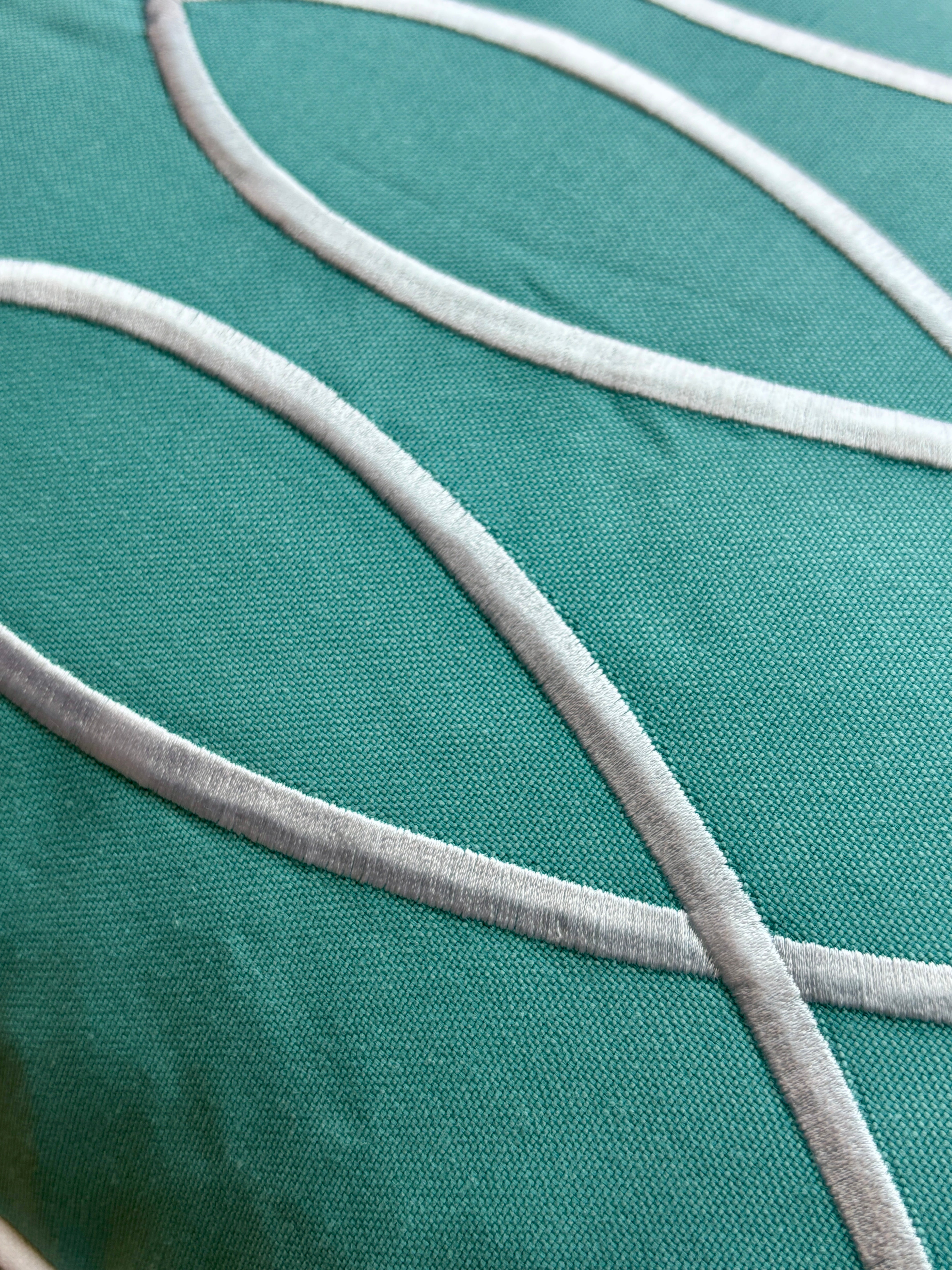 16"x24" 35x50 cm Trifin decorative pillow in Turquoise color, featuring three overlapping teal fish-shaped embroidery designs on a rectangular beige fabric.