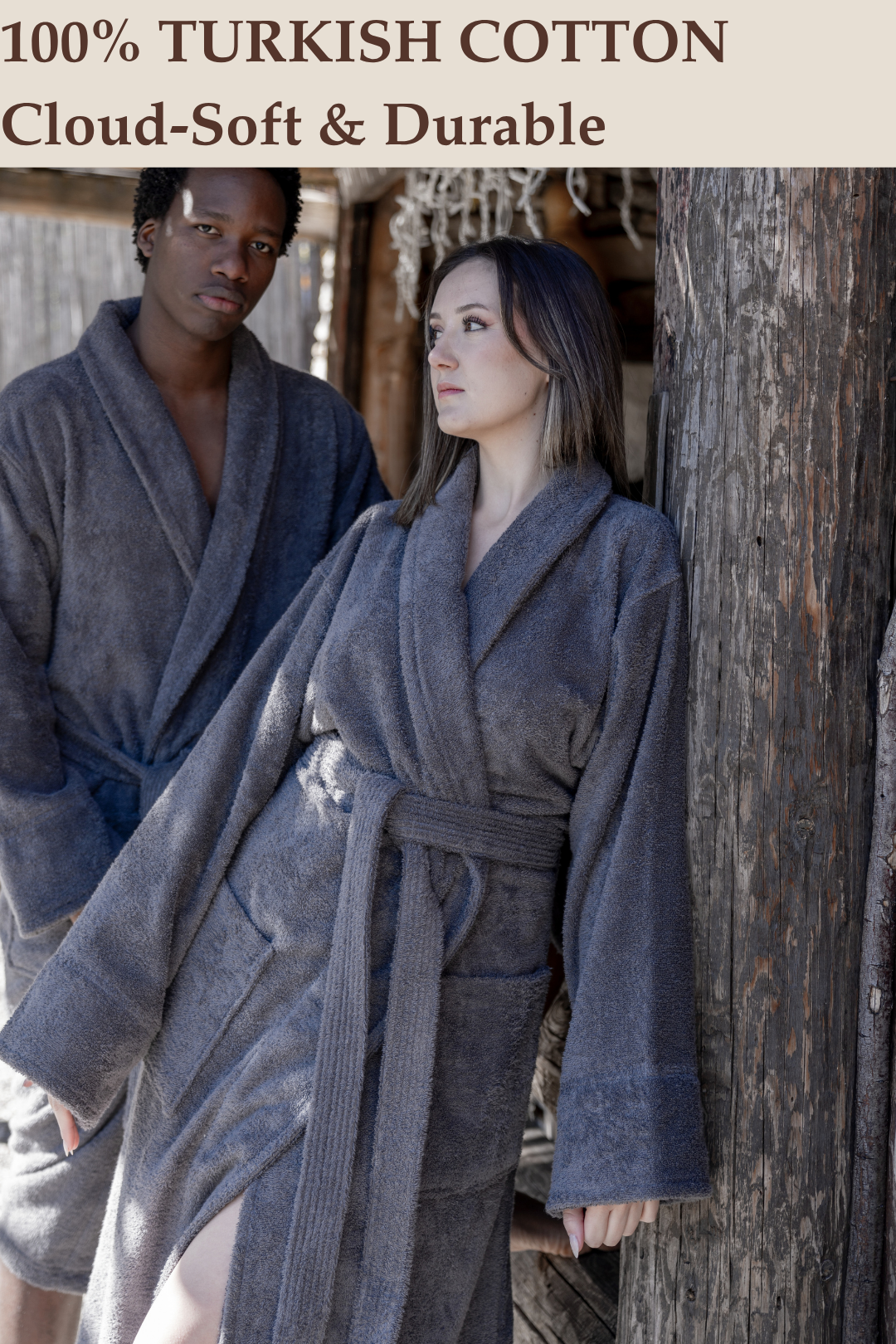 A man and woman wearing matching cloud-soft, hotel-quality dark grey 100% Turkish cotton terry cloth bathrobes