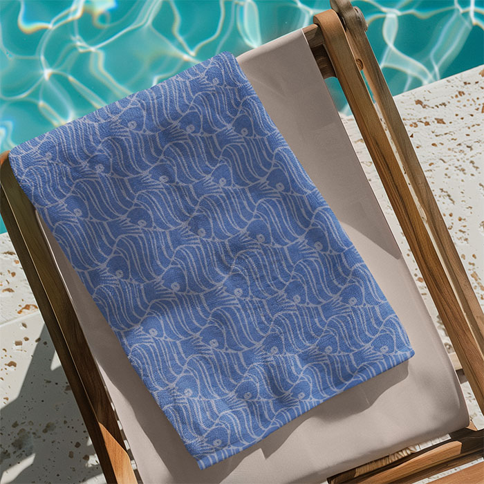 Colorful blue beach towel by Harbourloom – quick-dry, lightweight, and fashionable, perfect for poolside lounging and seaside adventures