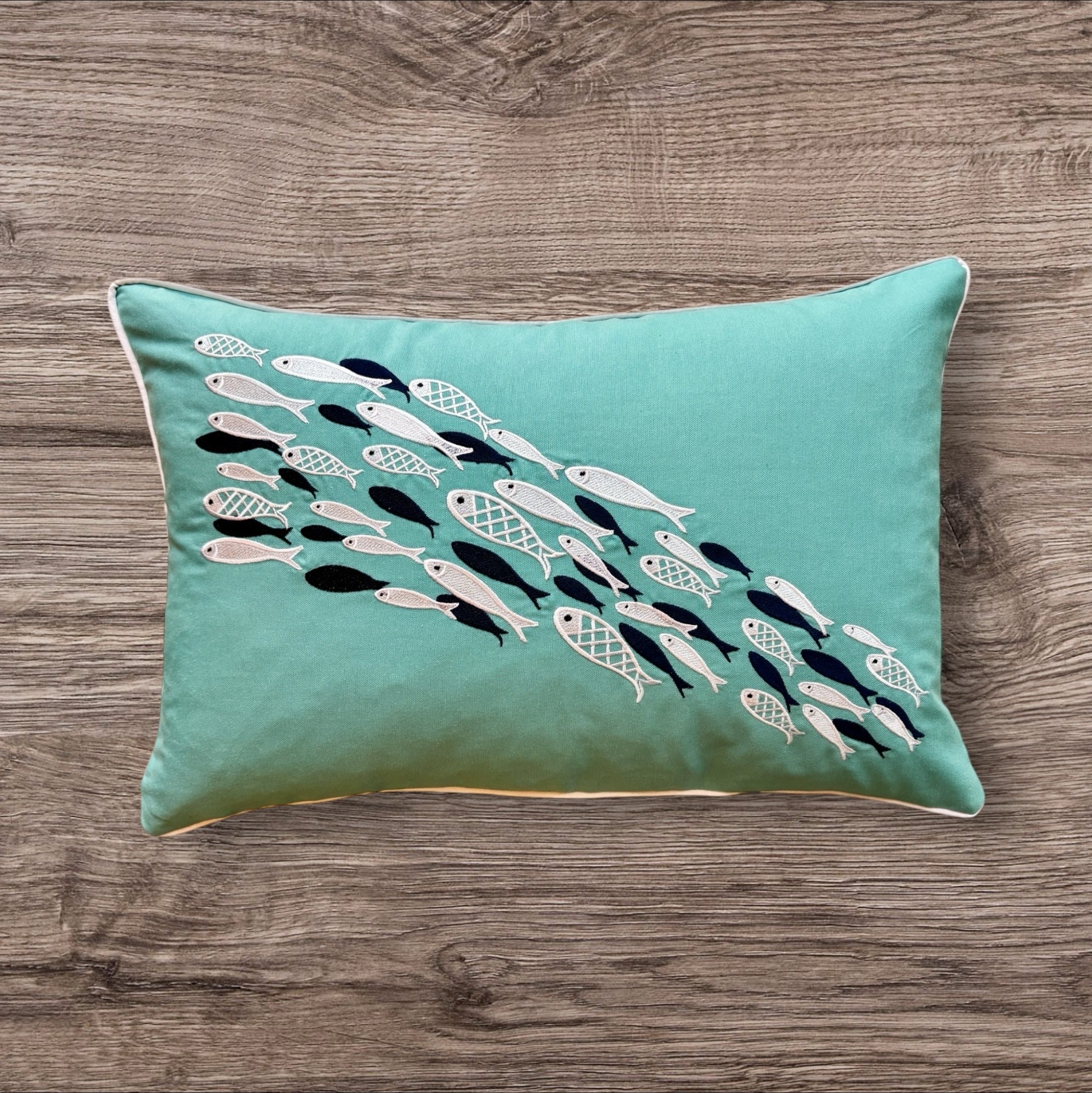 Aqua Dance decorative pillow in turquoise, measuring 14 x 20 inches (35 x 50 cm), designed for life at sea. Made from durable linen with a tailored finish, it combines refined style with practical function aboard boats and sailboats. The serene turquoise tone reflects the colors of open water, bringing a sense of calm and cohesion to nautical interiors.