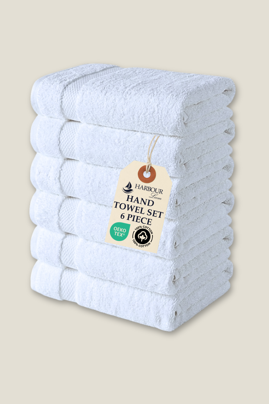 Set of six white hand towels with a Harbour tag on a beige background