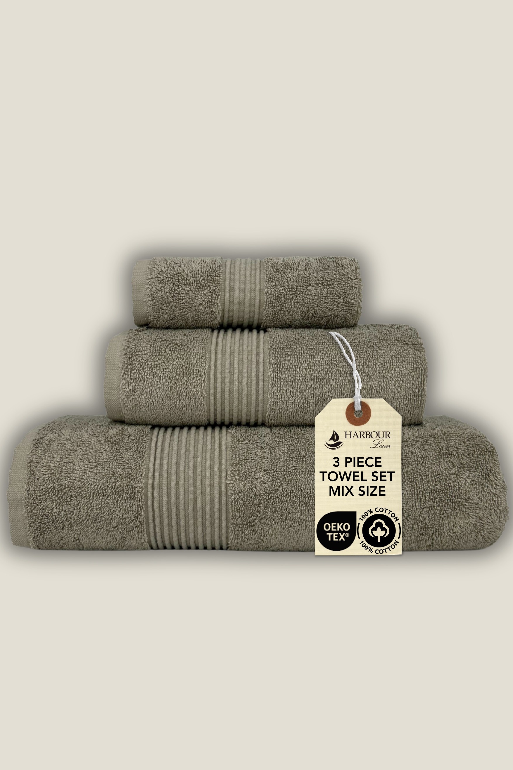 Set of three brown taupe towels with a tag on a beige background