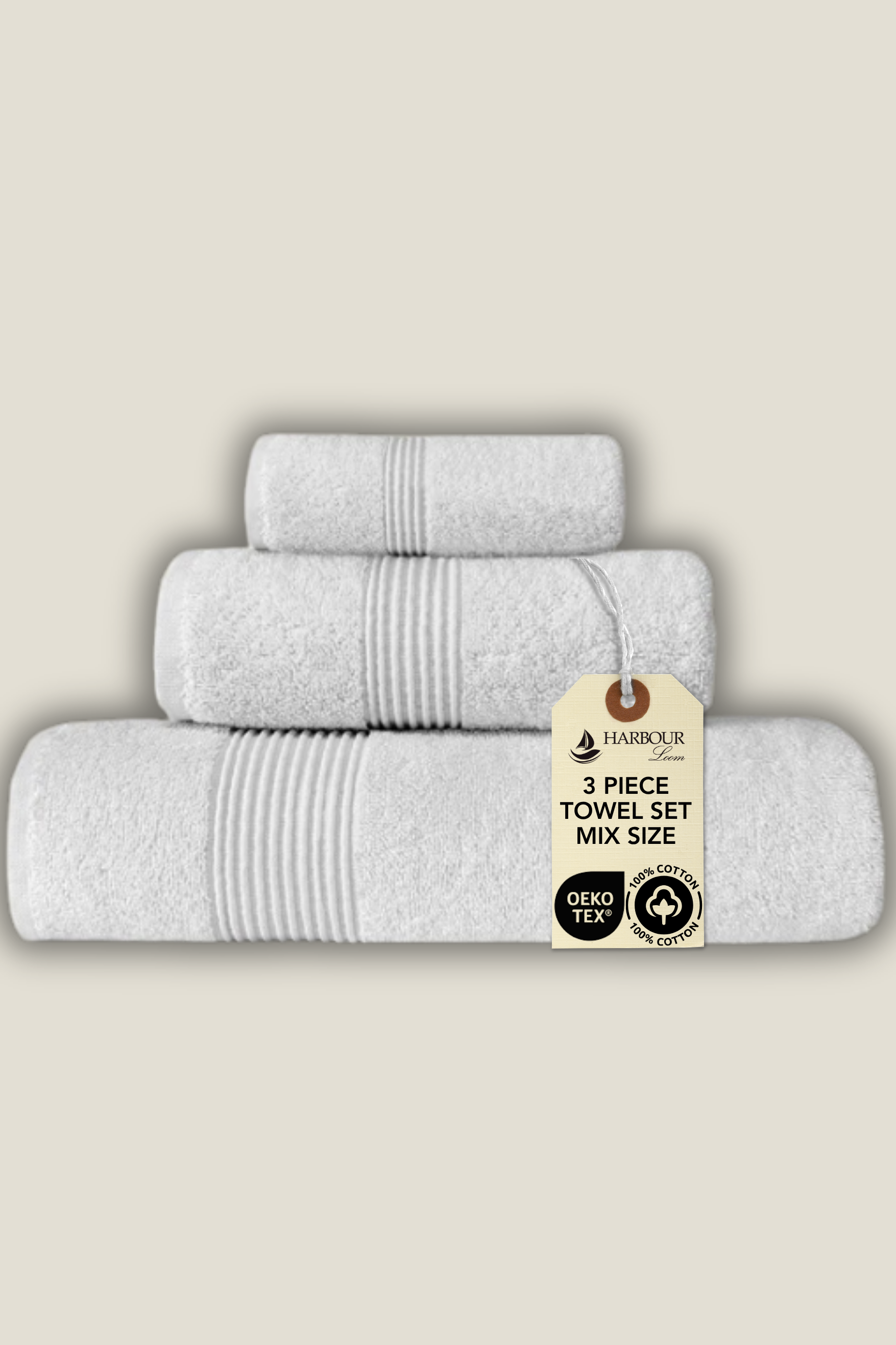Luxury white ribbed cotton towel set including large bath towel, hand towel, and washcloth.