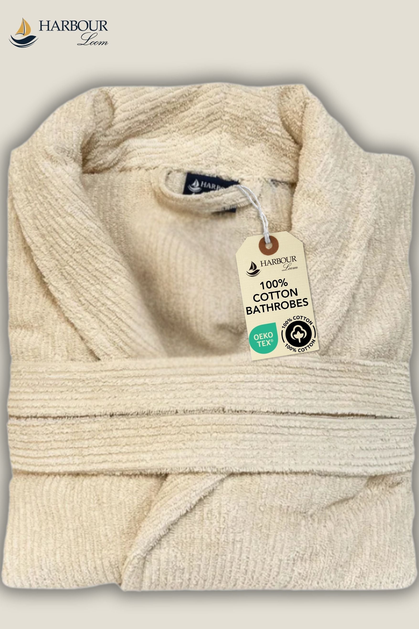 Soft cream beige Turkish cotton bathrobe folded neatly, showing premium fabric quality and Harbour Loom label.