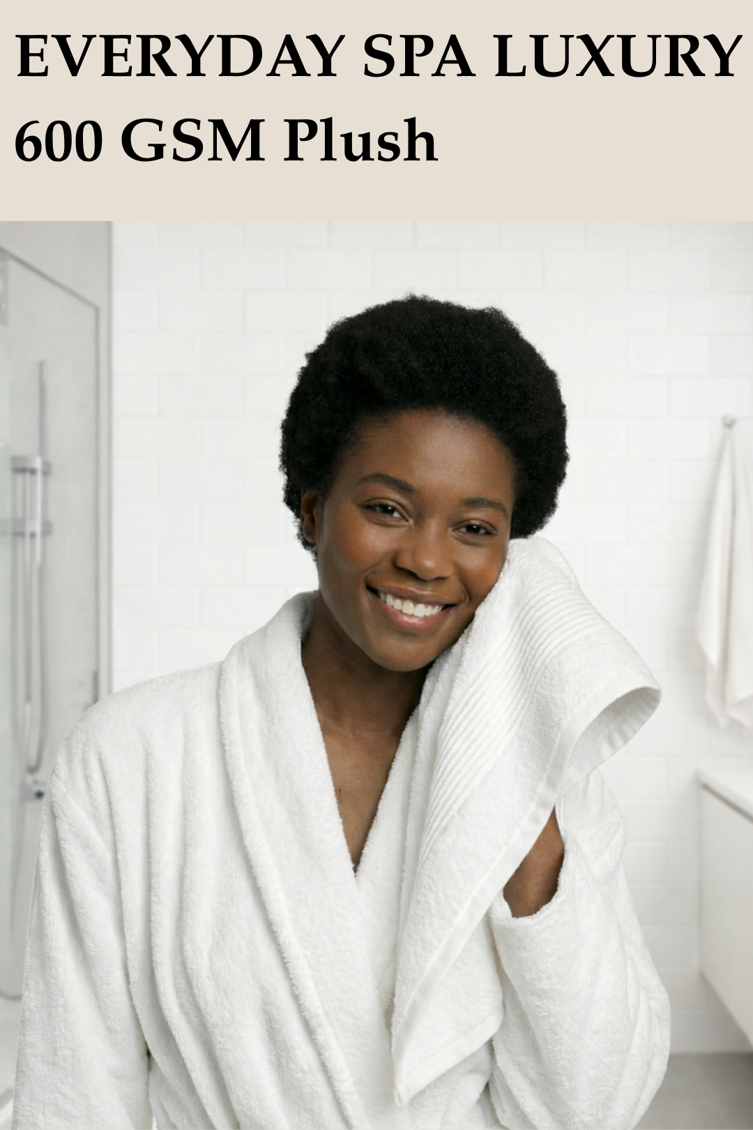 Smiling woman drying her face with a plush 600 GSM white Turkish cotton towel in a bright bathroom setting.
